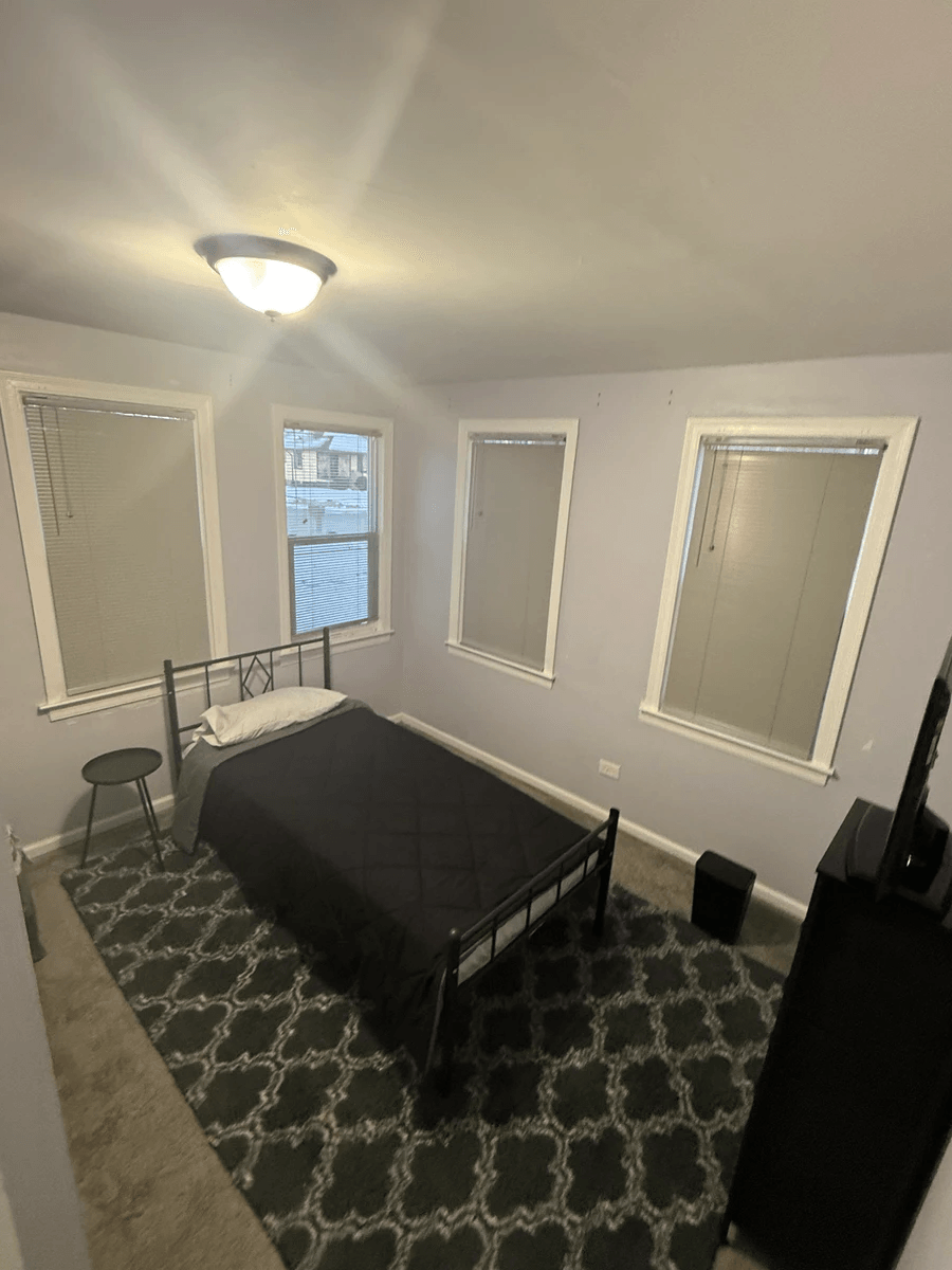 Spacious bedroom with large windows