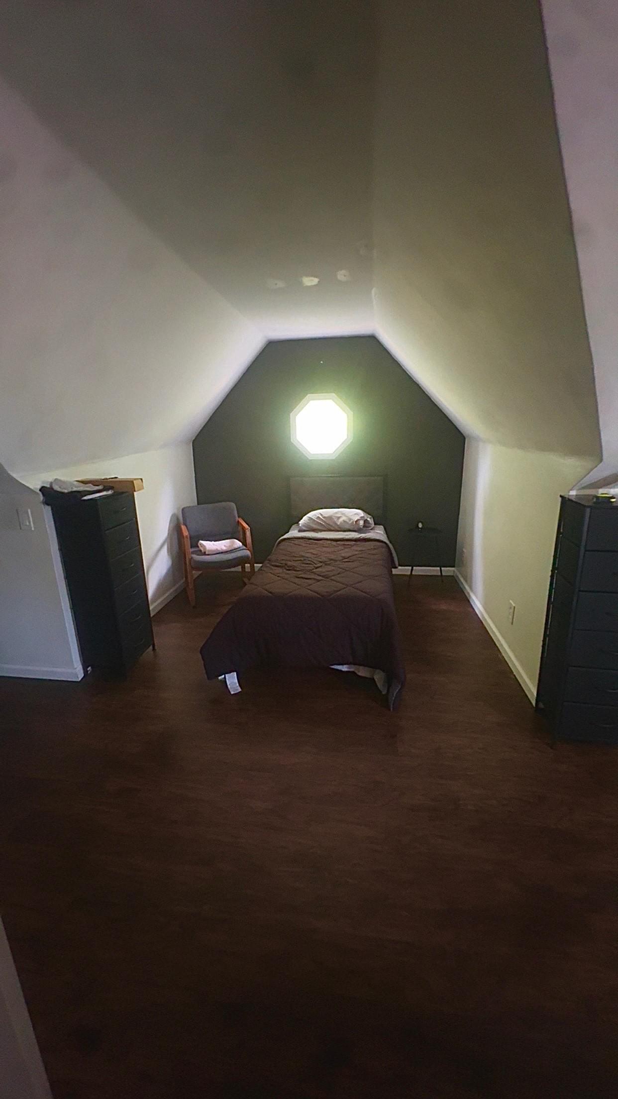 Unique bedroom suite with octagonal window