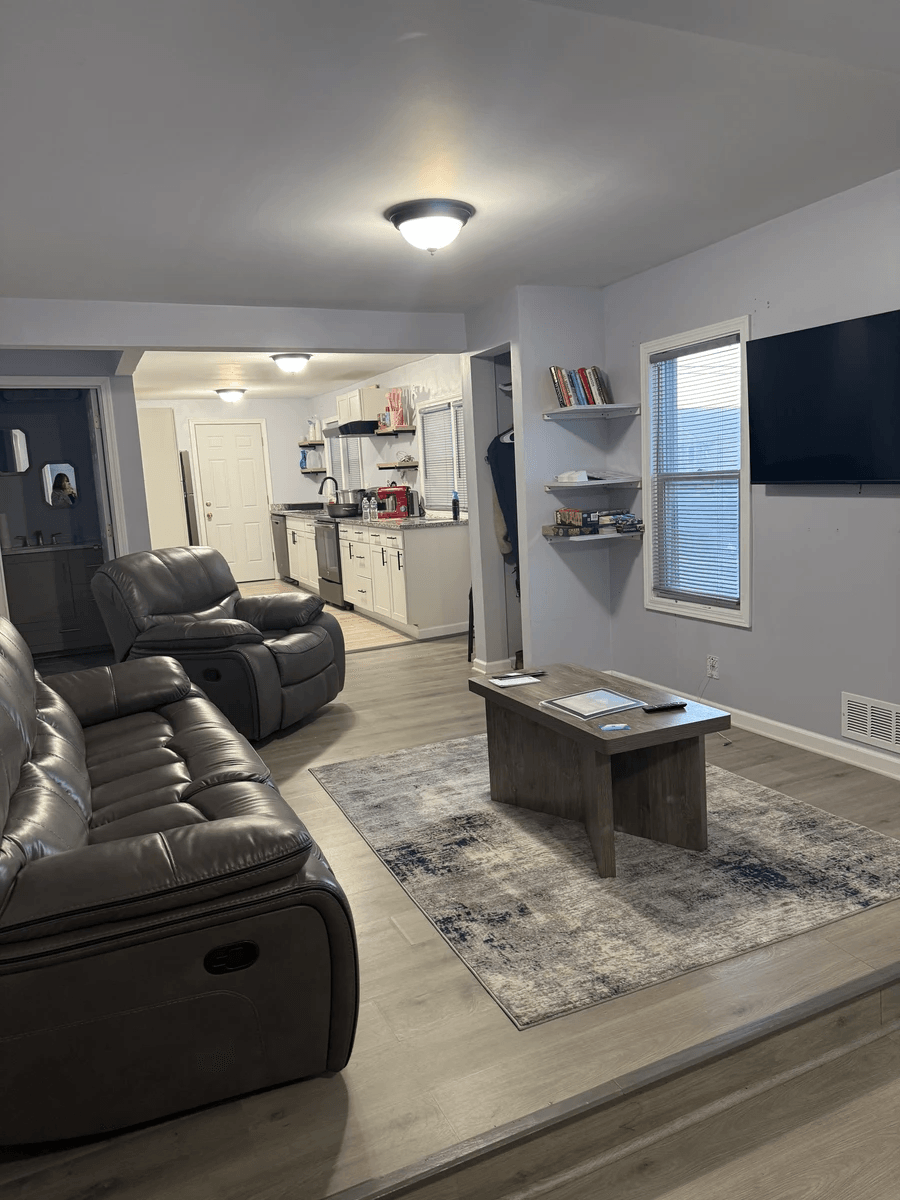 Living room with kitchen in background