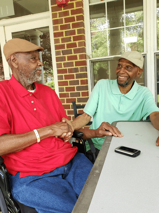 Two residents laughing together