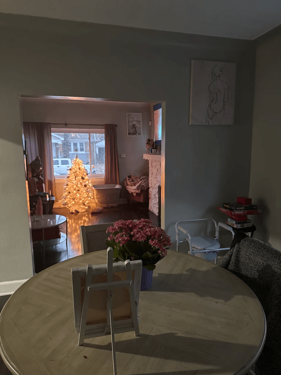 Warm dining room with Christmas tree glow